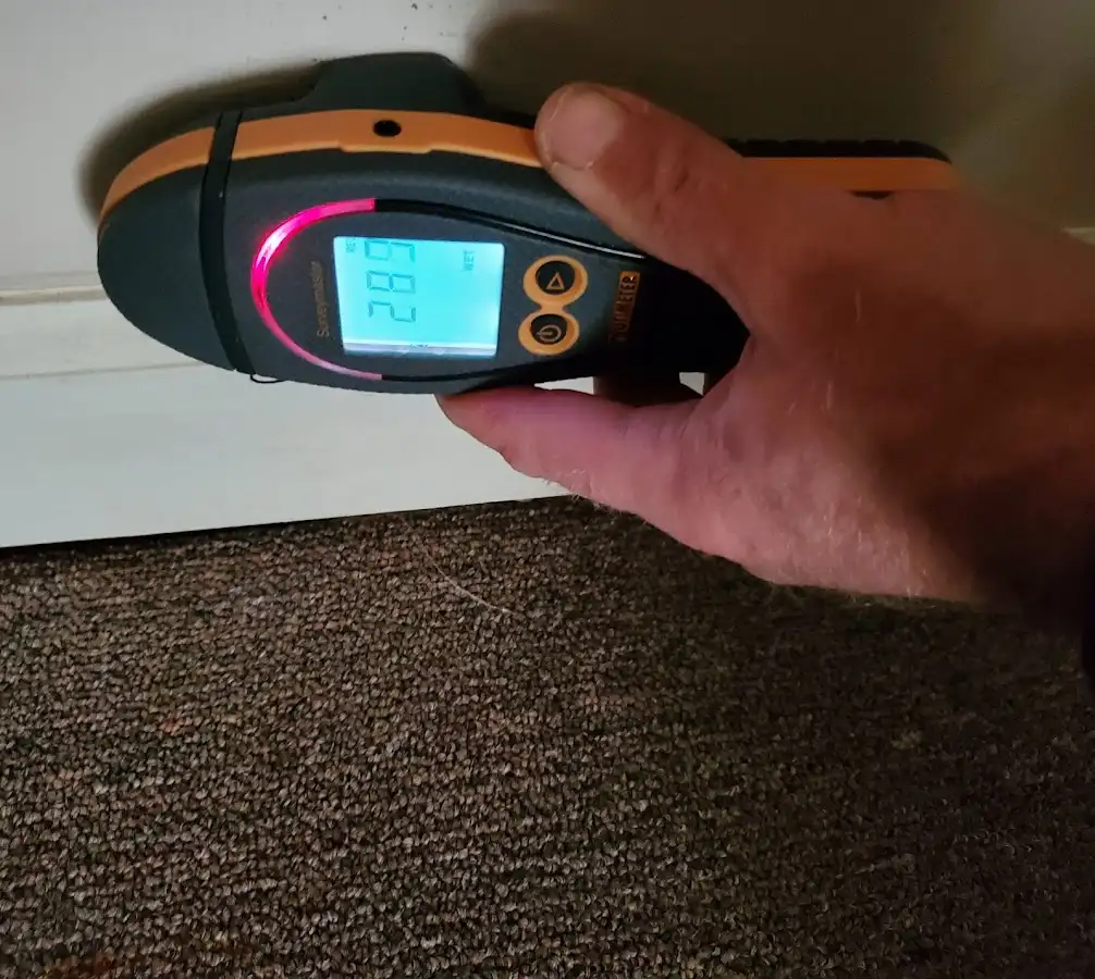 Moisture detection at baseboard during Storm Damage Restoration in Groton